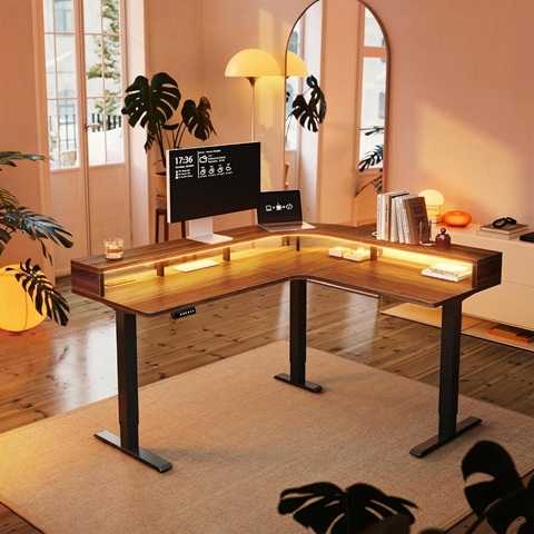 Amazon - HUANUO L Shaped Electric Standing Desk with LED Strip & Power Outlets, 63'' x 55'' 2-Tier Height Adjustable Sit Stand up Desk, Large Corner Gaming Desk with Power Strip Holder, Walnut